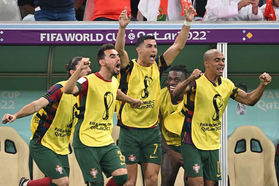 Cristiano Ronaldo celebrated from the bench after his team scored their second goal against Switzerland