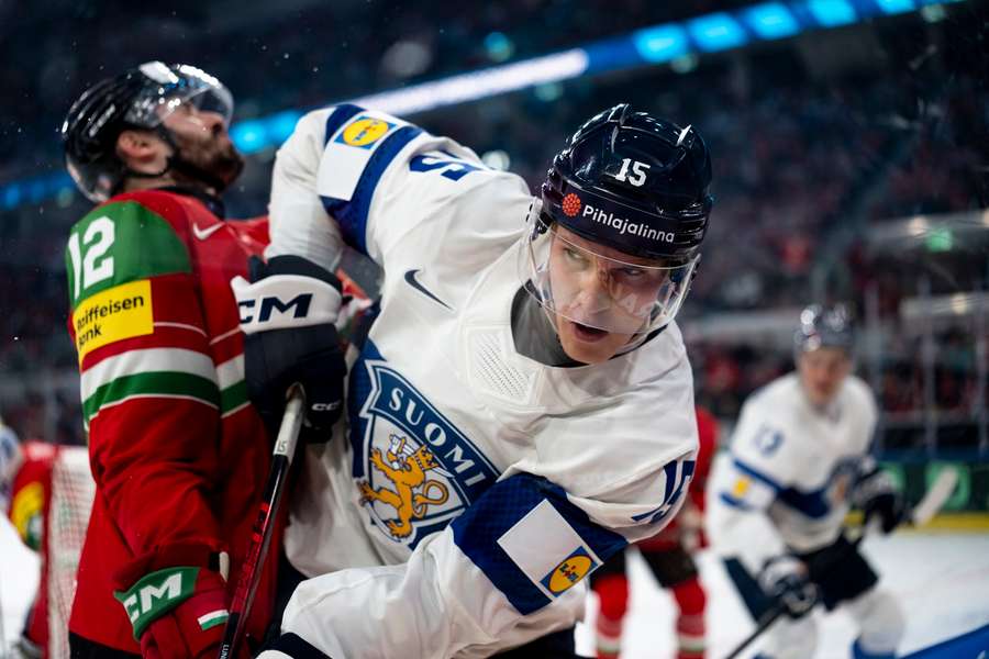 Finland's Anton Lundell protects the puck against Hungary Finland's Anton Lundell protects the puck against Hungary