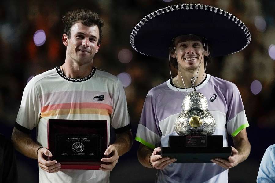 Paul and De Minaur with their trophies