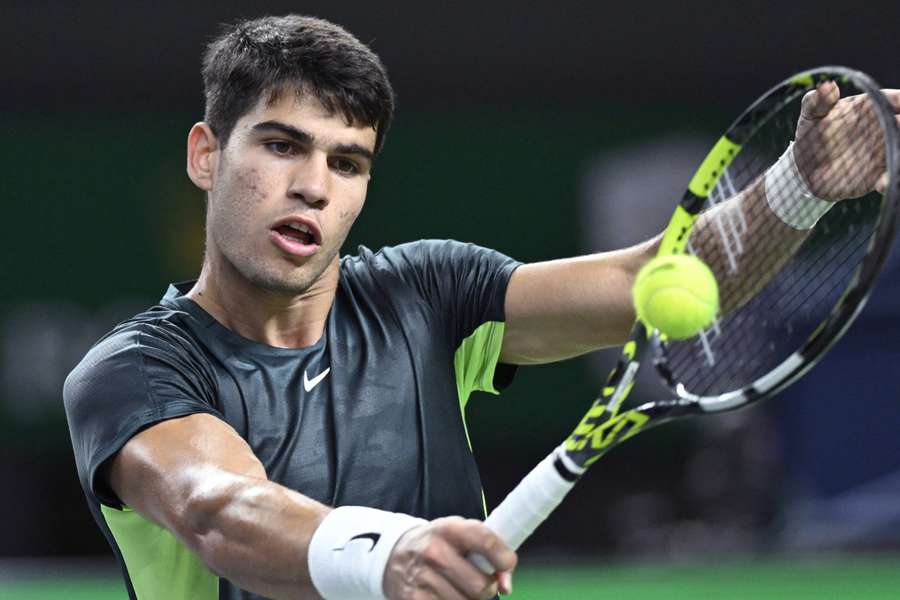 Carlos Alcaraz hits a return to Grigor Dimitrov during their match at the Shanghai Masters earlier this month