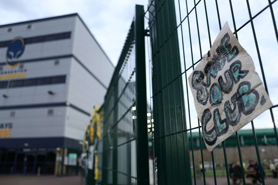 A sign reading SAVE OUR CLUB can be seen on entrance to the fanzone Worcester Warriors v Newcastle Falcons