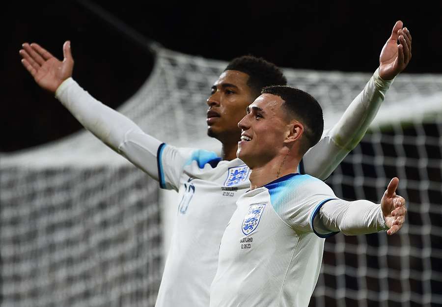 Jude Bellingham celebrates scoring England's second goal alongside Phil Foden