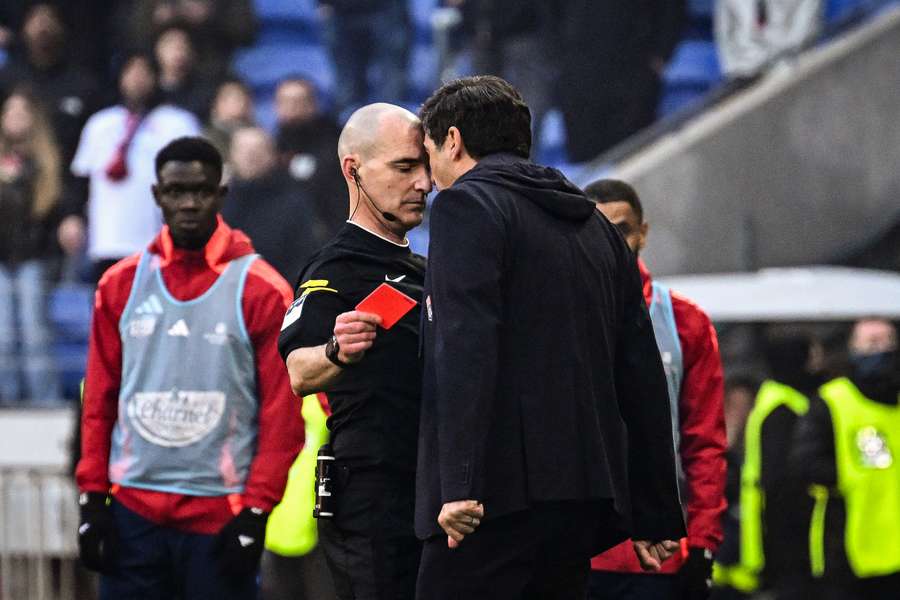 Paulo Fonseca yells at referee Benoit Millot after receiving a red card during Lyon's match against Brest