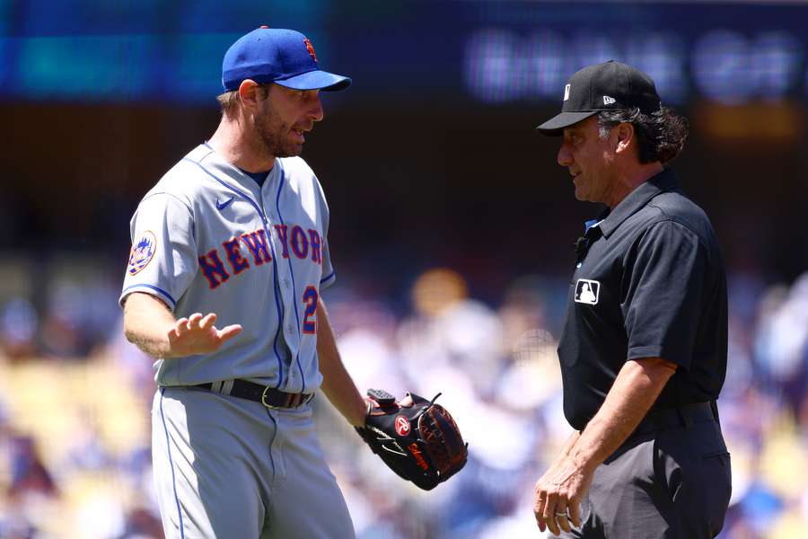 Max Scherzer of the New York Mets argues with the umpire