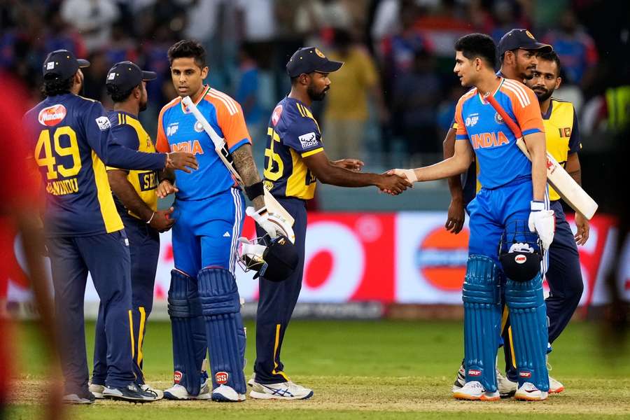 Indian and Sri Lankan players shake hands after the game