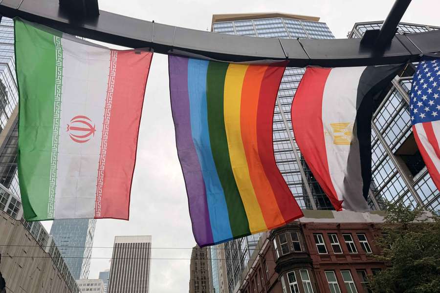 The Iranian, rainbow and Egyptian flags fly in Seattle