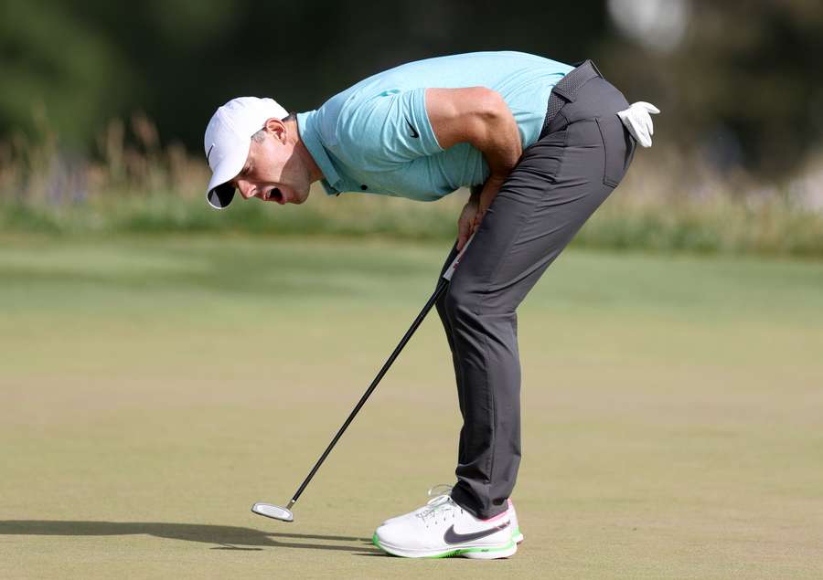 Rory McIlroy of Northern Ireland reacts to a missed birdie putt on the tenth green