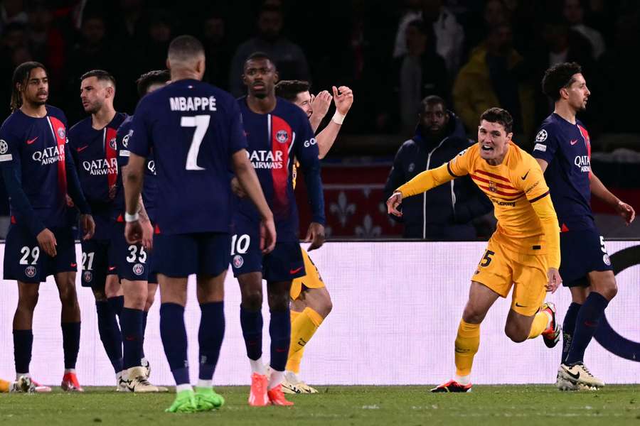 The PSG players show their disappointment as Barcelona celebrate Andreas Christensen's goal