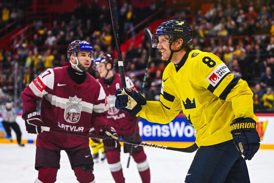 Jonas Brodin celebrates Sweden's fifth goal in the 6-0 victory over Latvia