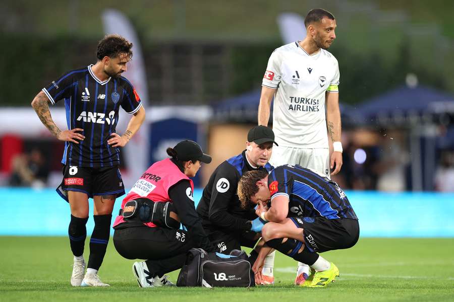 Nando Pijnaker winces in pain after dislocating a shoulder against Melbourne Victory at the weekend.