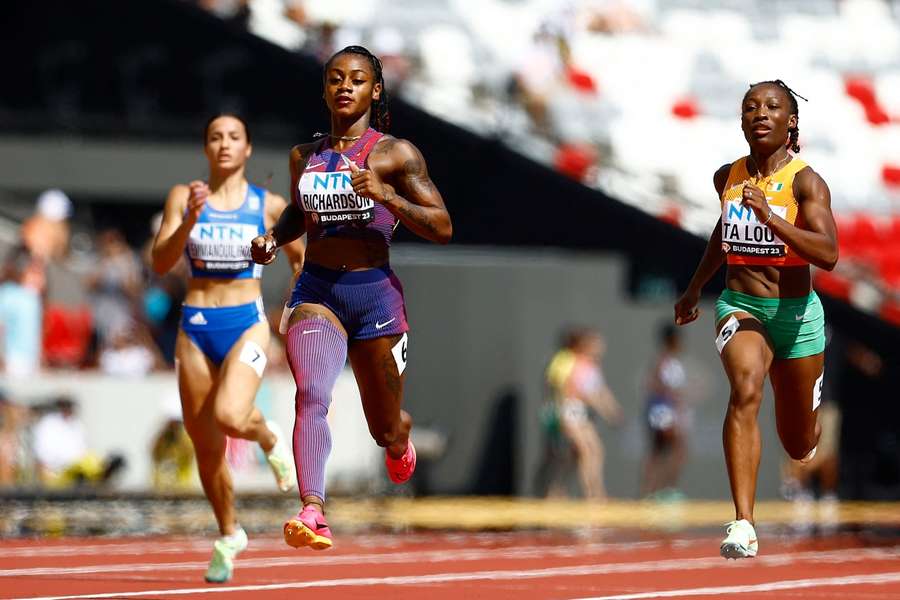 Sha'carri Richardson of the US and Cote D'Ivoire's Marie-Josee Ta Lou in action during heat 2