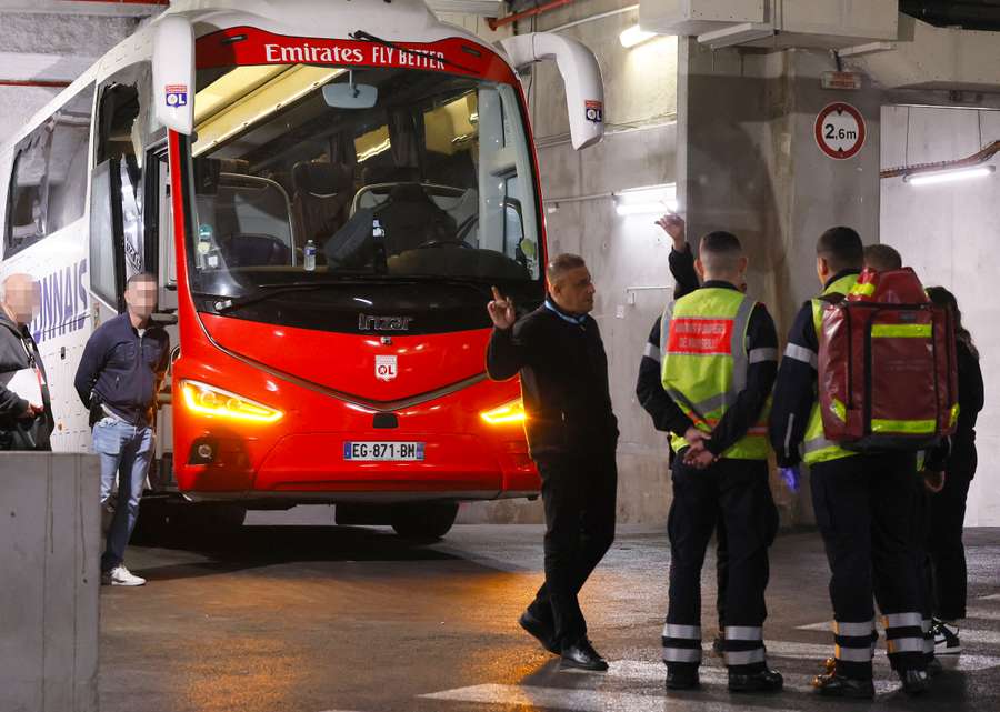 Lyon's team bus, showing one window completely broken and another damaged Lyon's team bus, showing one window completely broken and another damaged