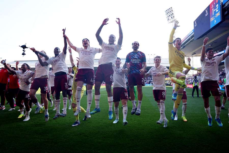 Arsenal's Declan Rice and Gabriel Magalhaes with teammates celebrate after the match