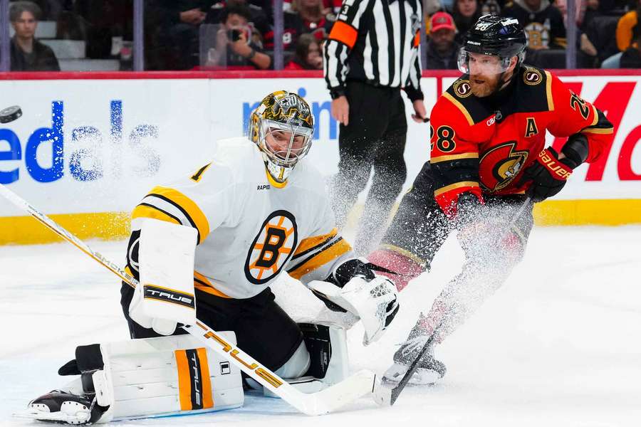 Bruins goaltender Jeremy Swayman and Senators skater Claude Giroux