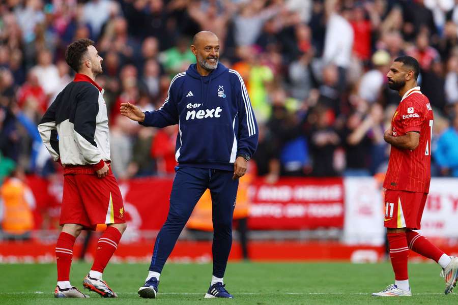 Nottingham Forest manager Nuno Espirito Santo celebrates after the match as Liverpool's Mohamed Salah looks dejected