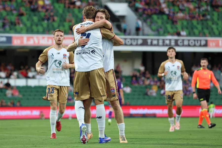Newcastle's Lachlan Bayliss celebrates his magnificent goal against Perth Glory.