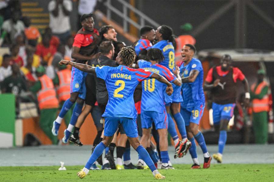 D.R. Congo's players celebrate scoring their team's third goal
