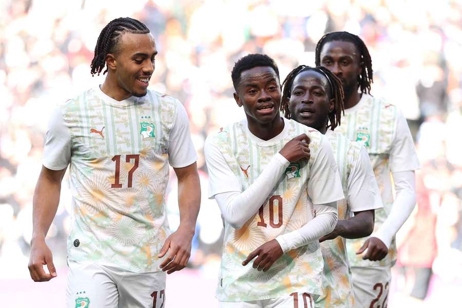 Simon Adingra (centre) celebrates scoring for Ivory Coast
