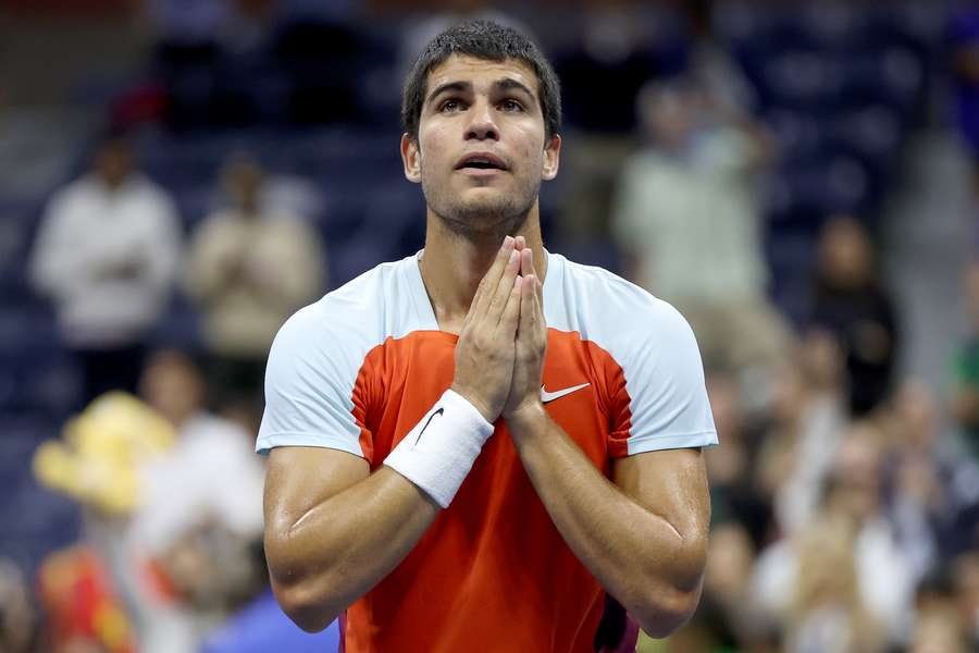 Carlos Alcaraz of Spain celebrates match point against Italy's Jannik Sinner during their US Open quarter-final.