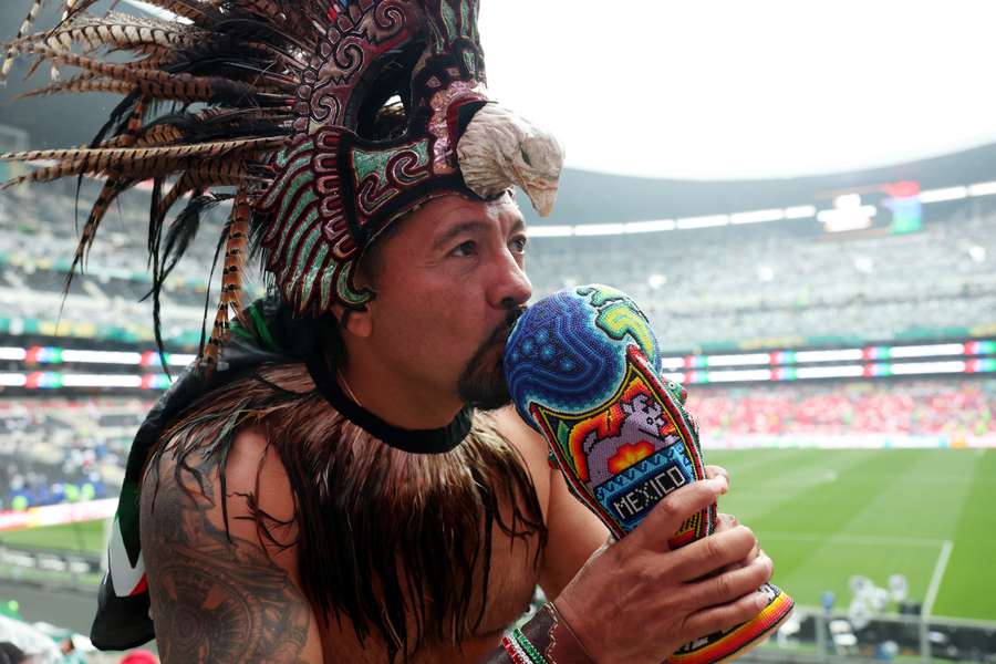 A Mexico fan inside the stadium before the match