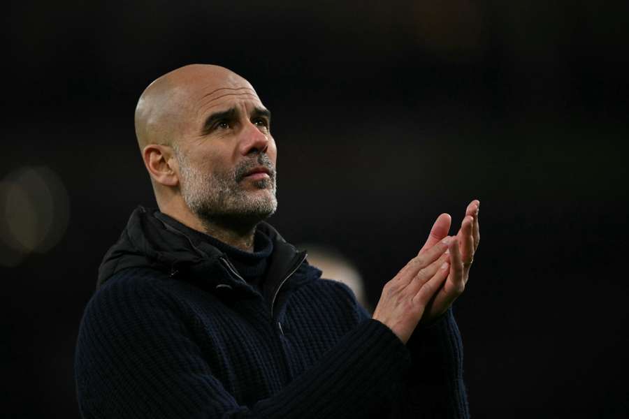 Pep Guardiola applauds fans following Man City's 5-1 defeat at Arsenal on Sunday