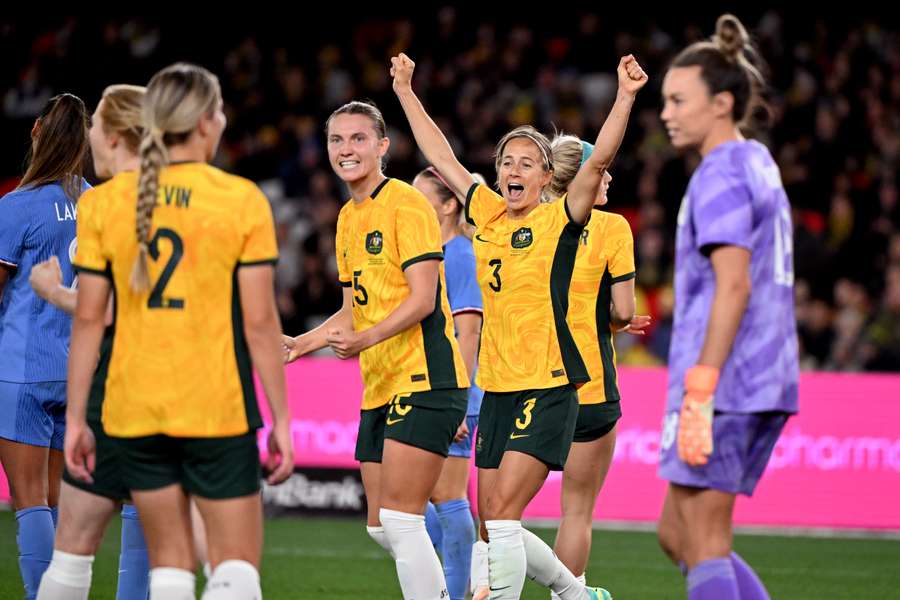 Aivi Luik celebrates with teammates after Australia beat France 