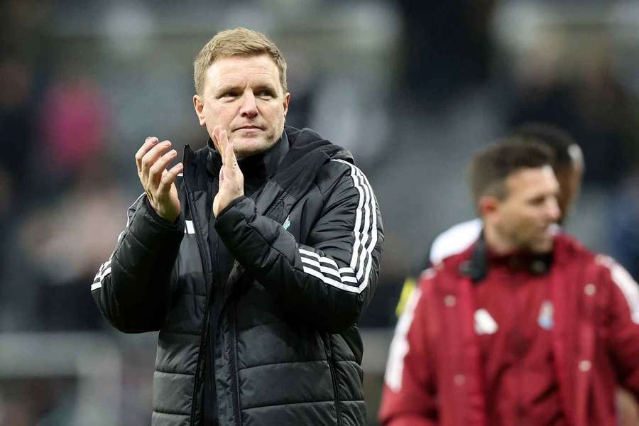 Eddie Howe, manager of Newcastle United, applauds the fans