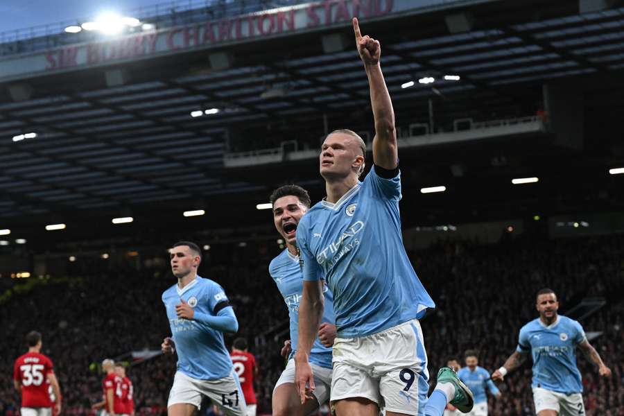 Erling Haaland celebrates after giving Man City the lead against rivals United