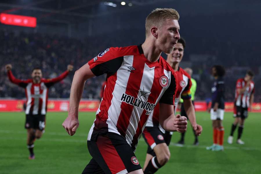 Brentford's English defender #16 Ben Mee celebrates after scoring their second goal