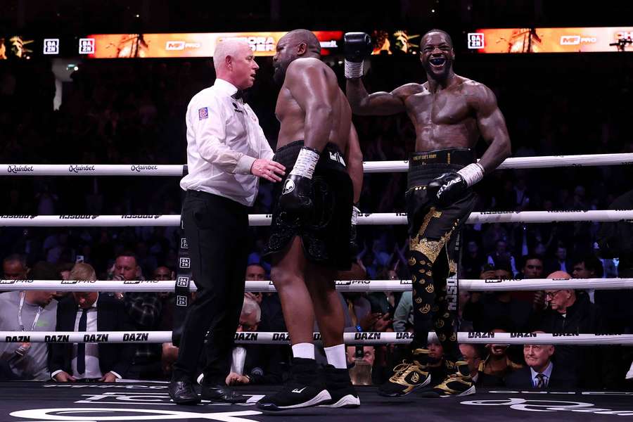 Deontay Wilder celebrates after the final bell