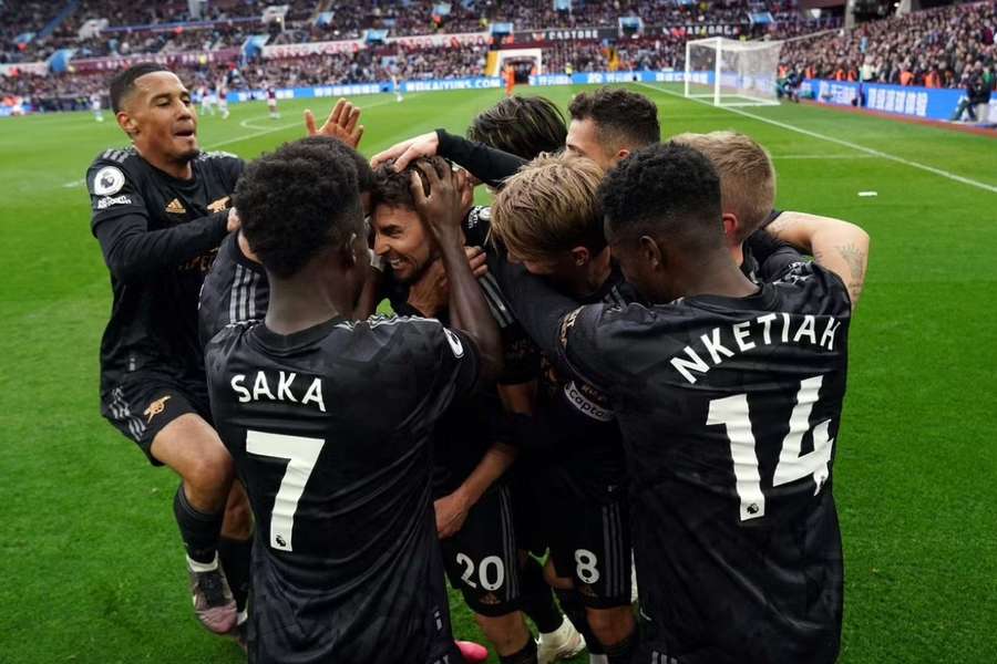 Arsenal celebrate their equaliser against Aston Villa