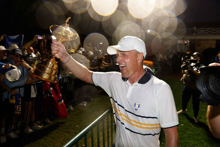 Luke Donald celebrates their win