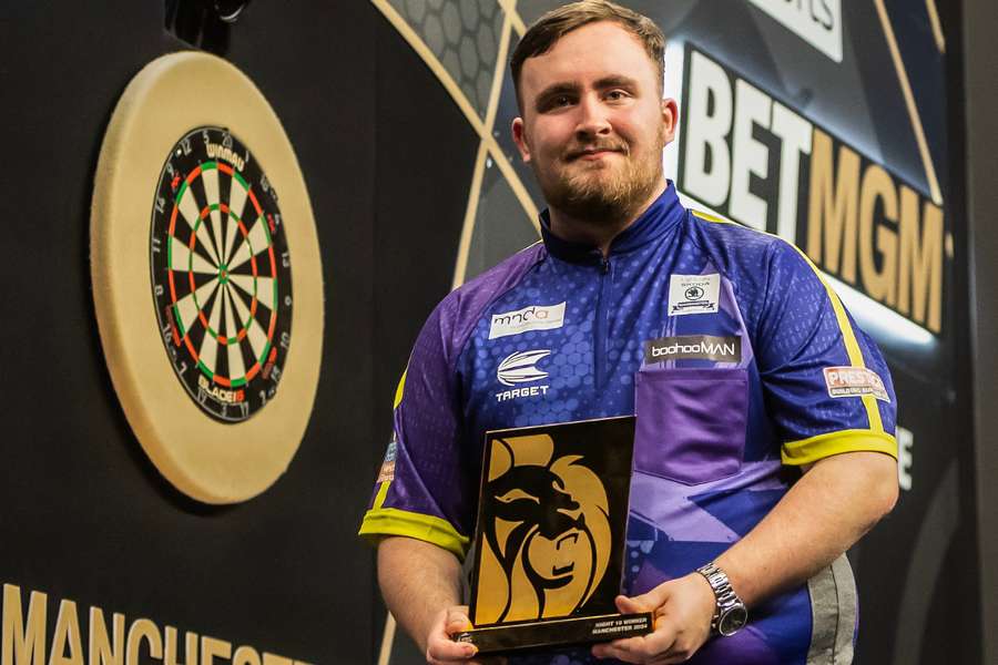 Luke Littler with his trophy after winning in Manchester
