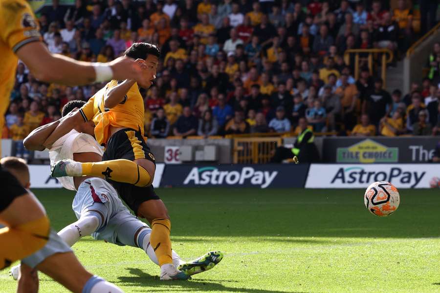 Wolverhampton Wanderers' South Korean striker #11 Hwang Hee-chan scores the opening goal