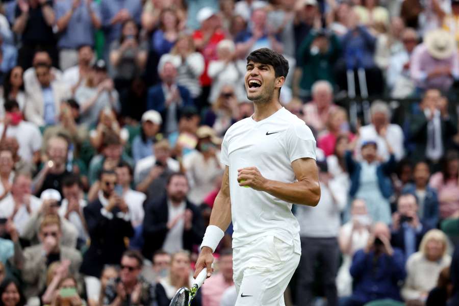 Carlos Alcaraz celebrates during his match with Ugo Humbert