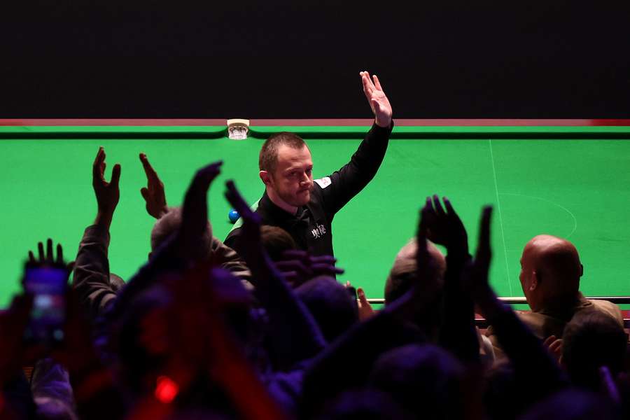 Mark Allen celebrates after making a 147 maximum break against Chris Wakelin