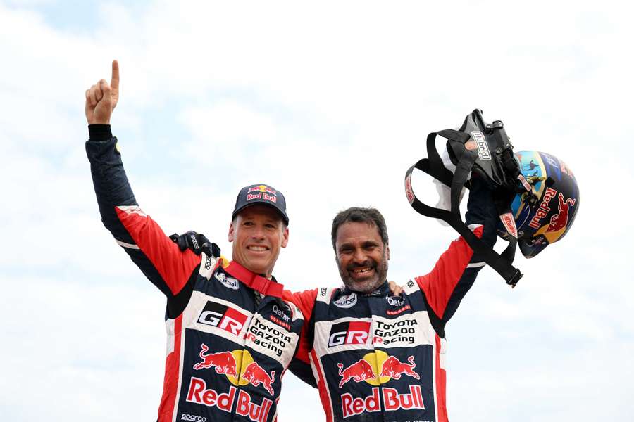 Toyota driver Nasser Al-Attiyah (R) and his co-driver Mathieu Baumel celebrate their victory after winning the Dakar Rally 2023