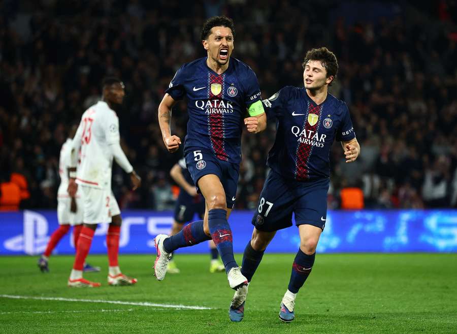 PSG's Marquinhos celebrates scoring their first goal with Joao Neves