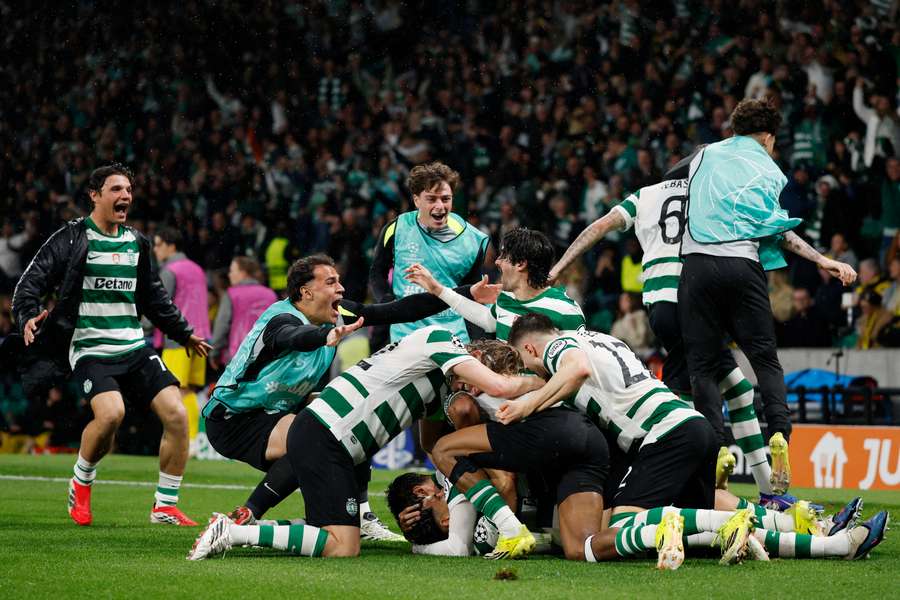 Sporting CP celebrate what proved to be their winning goal in their Champions League return leg match.