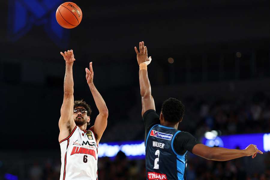 Illawarra Hawks' Will Hickey shoots past Melbourne United's Tyson Walker at John Cain Arena on Thursday night. Illawarra Hawks' Will Hickey shoots past Melbourne United's Tyson Walker at John Cain Arena on Thursday night.