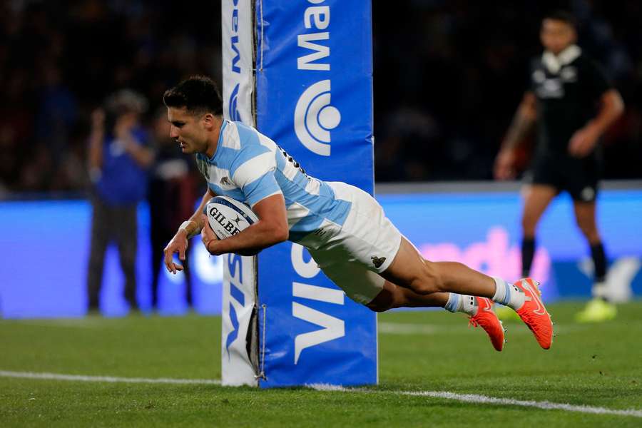 Argentina flyhalf Tomás Albornoz dives over the line between the posts during their loss to New Zealand.