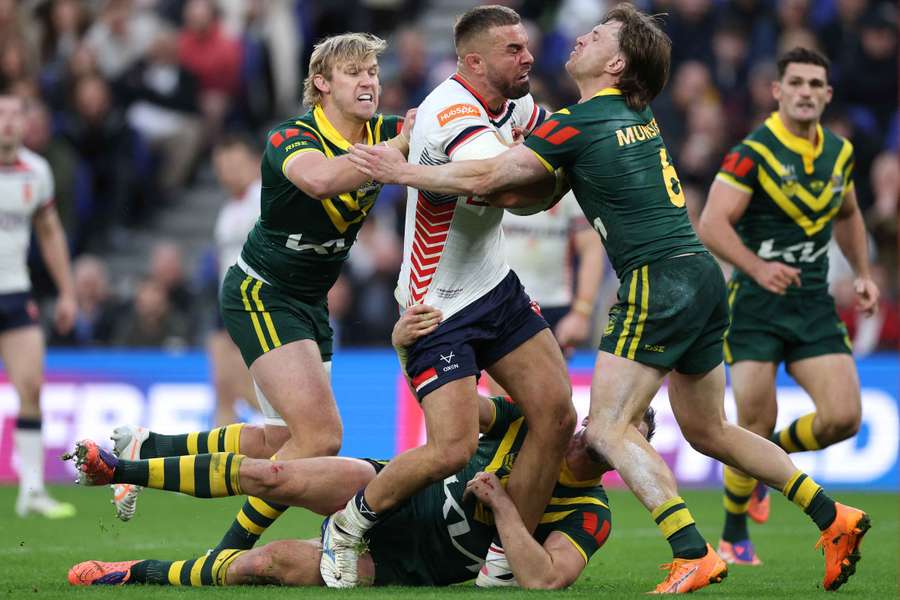 Lindsay Smith (left) makes way for Kangaroos captain Isaah Yeo. Lindsay Smith (left) makes way for Kangaroos captain Isaah Yeo.