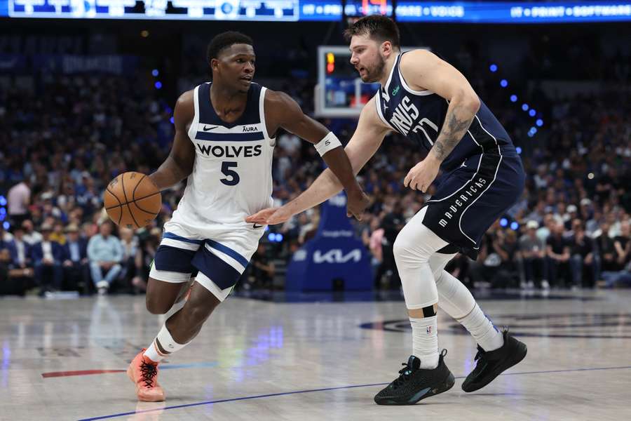 Anthony Edwards of the Minnesota Timberwolves is defended by Luka Doncic of the Dallas Mavericks in Game 4 of the Western Conference Finals