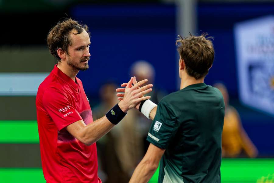 Medvedev (L) and Arnaldi shake hands at the net