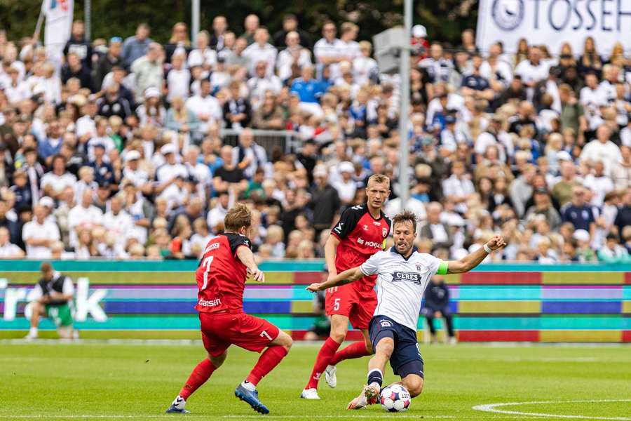 AGFs Patrick Mortensen fights for the ball surrounded by Fredericia players AGFs Patrick Mortensen fights for the ball surrounded by Fredericia players