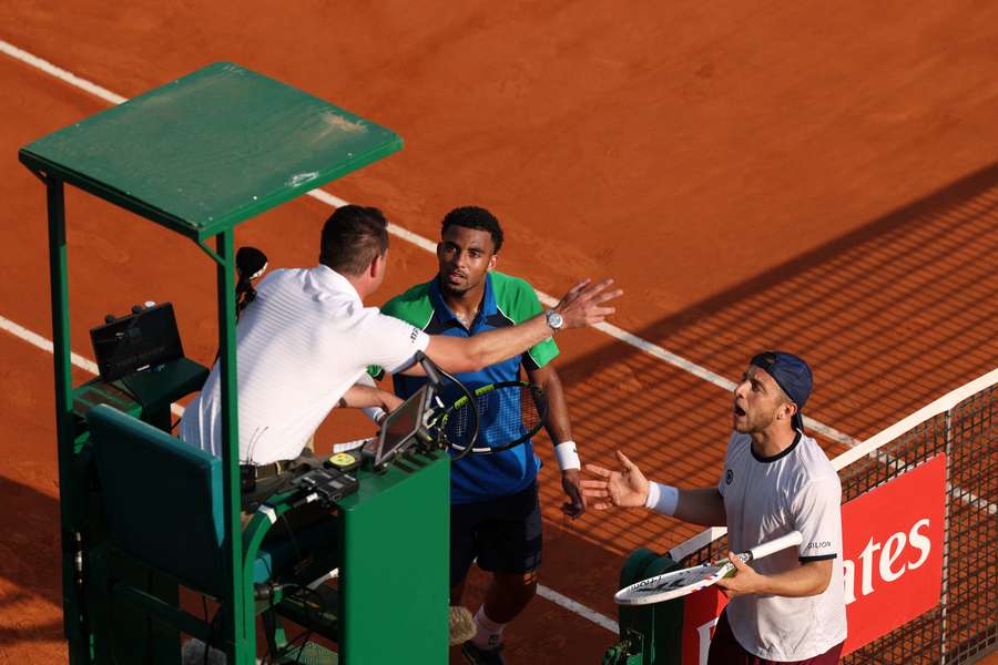 Arthur Fils and Tallon Griekspoor talk to the umpire during their match in Monte Carlo Arthur Fils and Tallon Griekspoor talk to the umpire during their match in Monte Carlo
