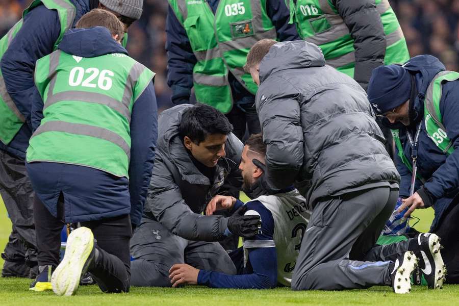  An injured Rodrigo Bentancur of Tottenham Hotspur receives medial attention on the pitch