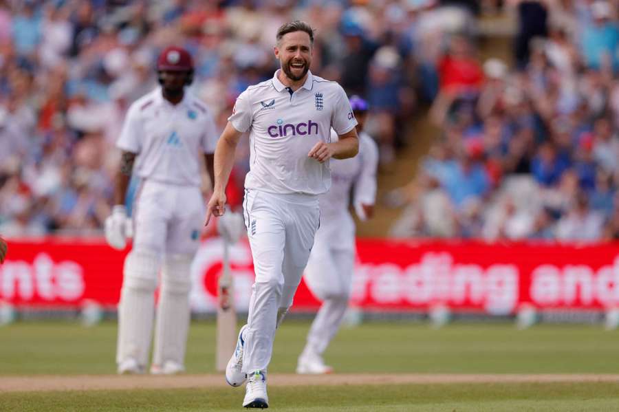 England's Chris Woakes celebrates after taking the wicket of West Indies' Kraigg Brathwaite