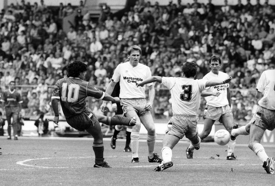Diego Maradona takes a shot during the Football League v Rest of the World game in 1987