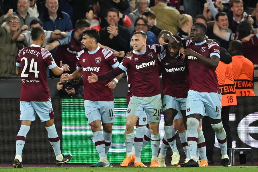 West Ham United's English midfielder Michail Antonio (2R) celebrates with teammates after scoring their second goal 